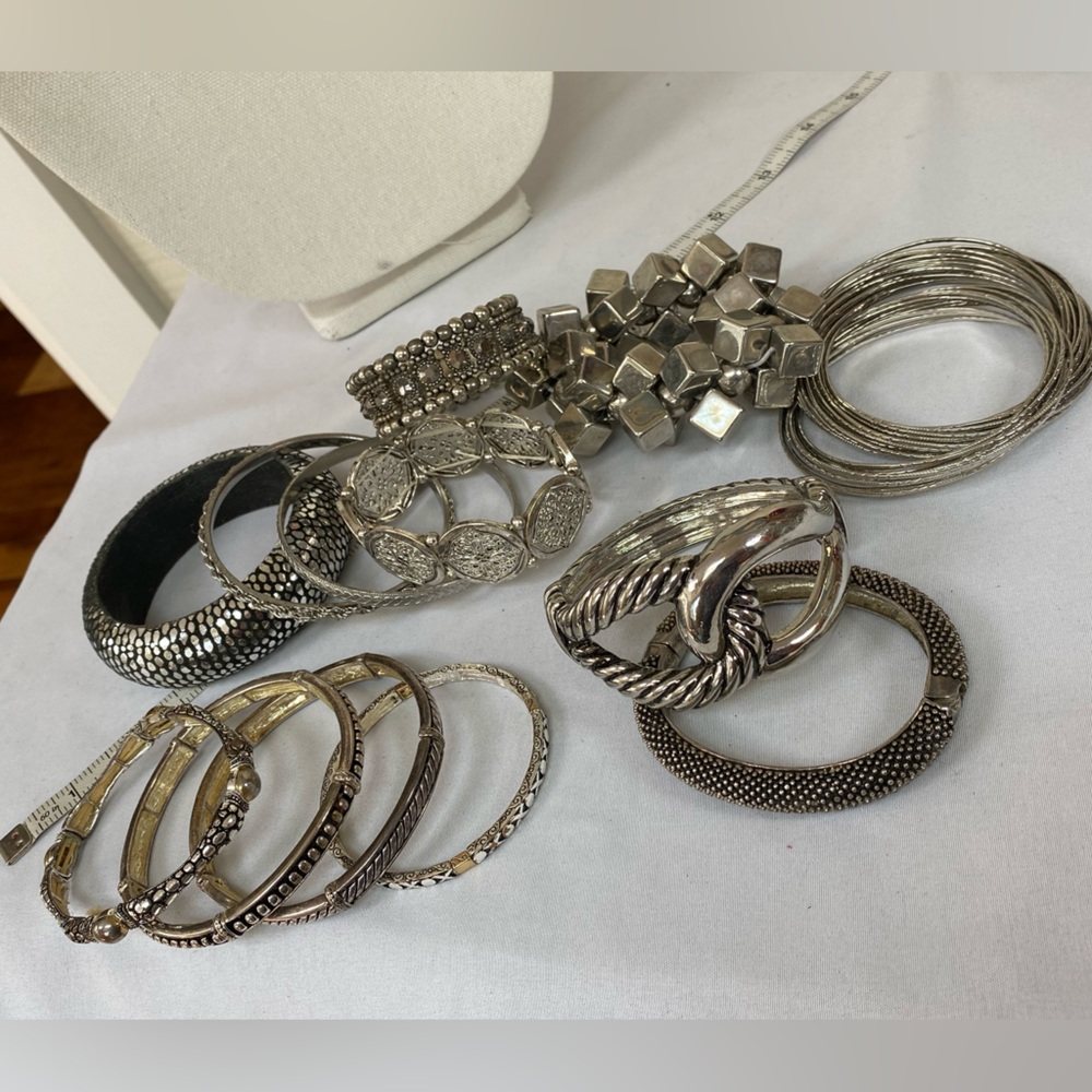 Group of 13 silvertone bracelets